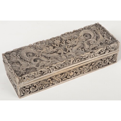 A Chinese silver plated rectangular box and cover. Cast in r...