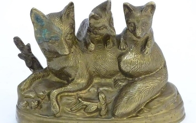 A Continental cast sculpture depicting a fox and two