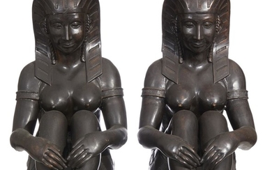 A DECORATIVE PAIR OF DARKLY PATINATED BRONZE SEATED EGYPTIAN FEMALE FIGURES