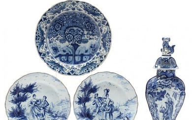 A Dutch Delft Blue and White Covered Vase and Three Plates