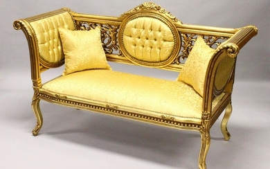 A FRENCH STYLE GILTWOOD SOFA, upholstered in a