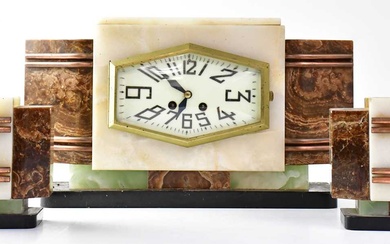 A French Art Deco eight-day mantel clock garniture, the hexagonal...