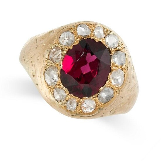 A GARNET AND DIAMOND DRESS RING in yellow gold, set