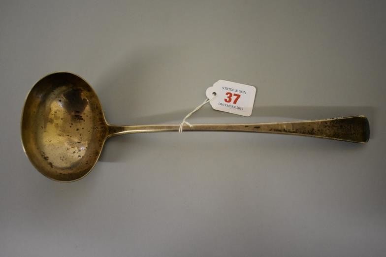 A George III Old English pattern silver soup ladle,...