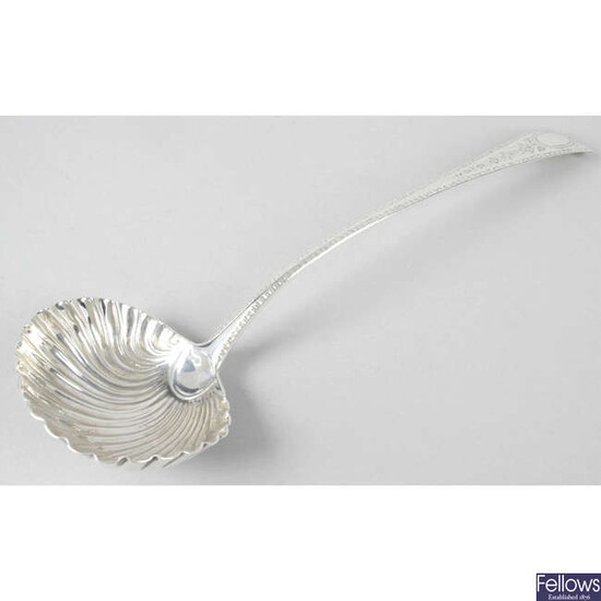 A George III silver soup ladle with shell bowl.
