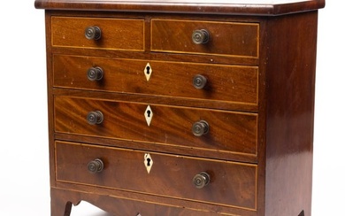 A George III style inlaid mahogany miniature chest of drawers