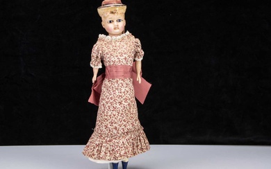 A German 19th century wax over composition shoulder head dolls with moulded hat