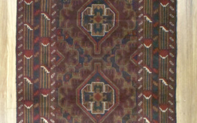 A HANDKNOTTED PURE WOOL PERSIAN BALUCHI RUG