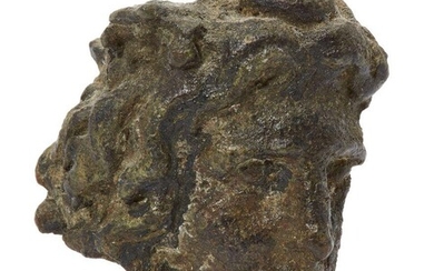 A Hellenistic fragmentary bronze hollow-backed head of a male Circa 3rd-1st Century B.C With thick wavy hair, possibly representing Alexander the Great, 2.8cm high Provenance: The Estate of costume designer Anthony Powell (1935-2021).