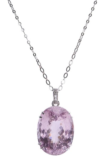 A KUNZITE AND DIAMOND PENDANT NECKLACE - The large oval kunzite weighing 91.38cts, in a double claw setting with diamond set bale, t...