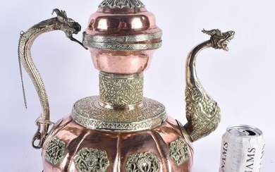 A LARGE 19TH CENTURY TIBETAN REPOUSSE WHITE METAL AND COPPER EWER decorated with dragons and buddhis
