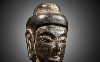 A LIMESTONE HEAD OF BUDDHA, NORTHERN WEI DYNASTY