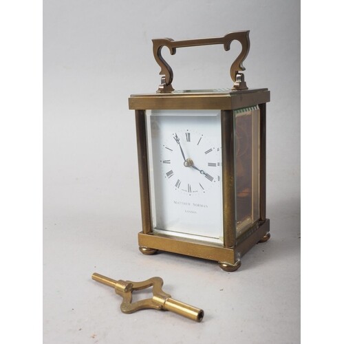 A Matthew Norman brass and glass cased carriage clock, 5" hi...
