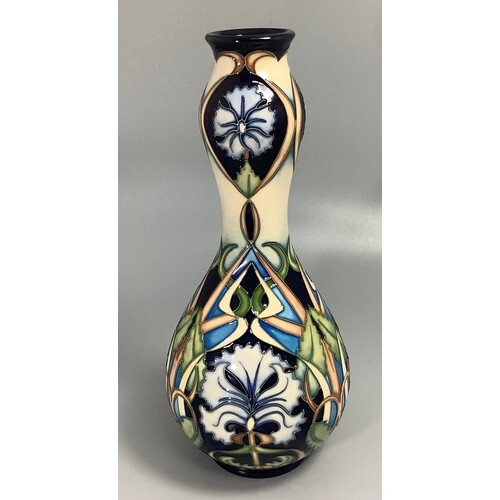 A Moorcroft pottery vase of double-gourd form, decorated in ...