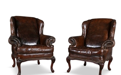 A PAIR OF BROWN LEATHER WINGBACK ARMCHAIRS, early 20th cent...