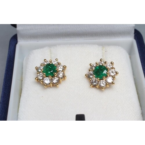 A PAIR OF EMERALD AND DIAMOND CLUSTER EAR STUDS, 18ct gold p...