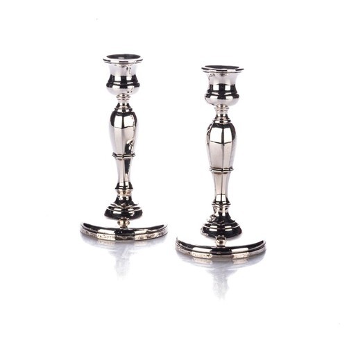A PAIR OF GEORGE V SILVER CANDLESTICKS, MAKER'S MARK RUBBED,...