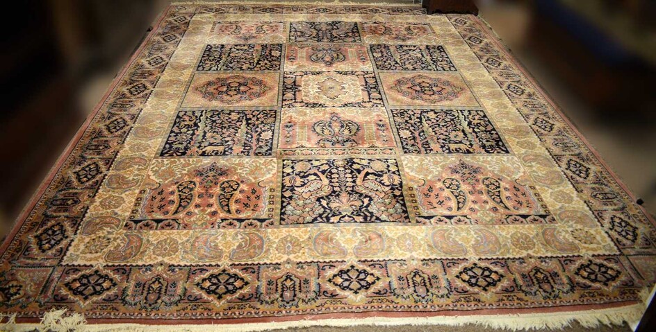 A Persian style woollen carpet by Saphir