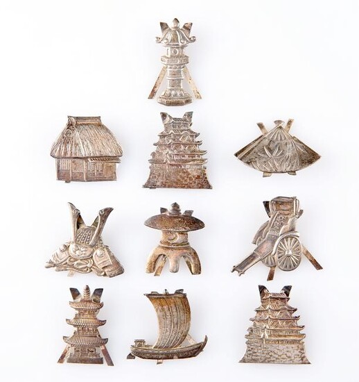 A SET OF TEN CHINESE SILVER PLACE CARD HOLDERS, each