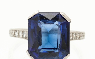 A Shreve & Co Platinum Ring set with a Synthetic Sapphire and Round Brilliant Cut Diamonds