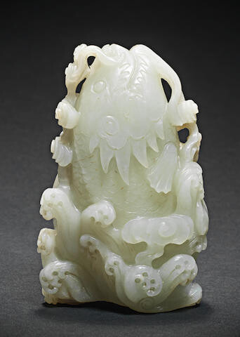 A VERY PALE GREEN JADE 'LEAPING CARP' VASE
