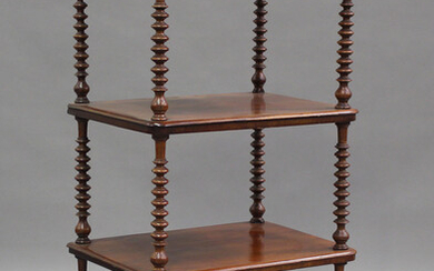A Victorian mahogany four-tier whatnot with pierced gallery top, raised on bobbin turned supports, h