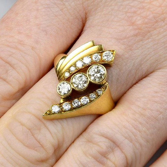 A brilliant-cut diamond crossover ring, with stepped