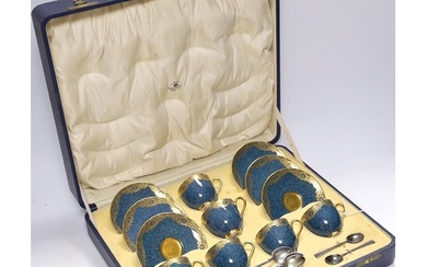 A cased Royal Worcester gilt and powder blue six piece coffe...