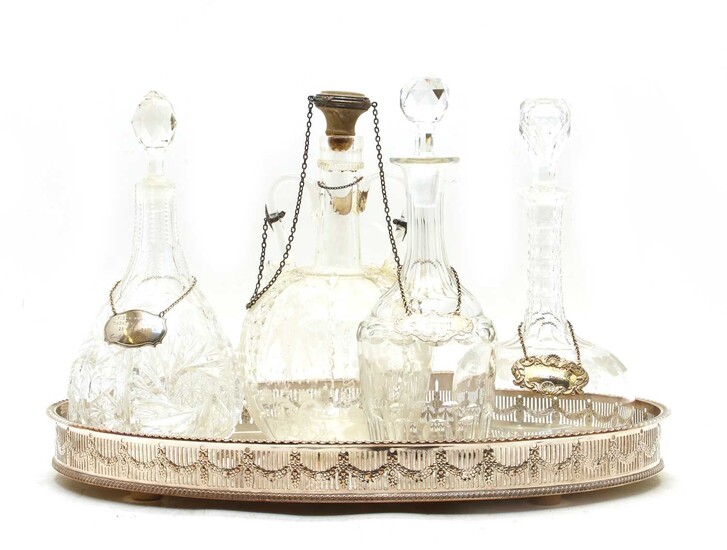 A collection of four cut glass decanters