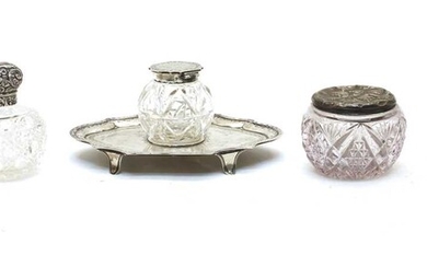 A collection of glass and silver mounted dressing table items