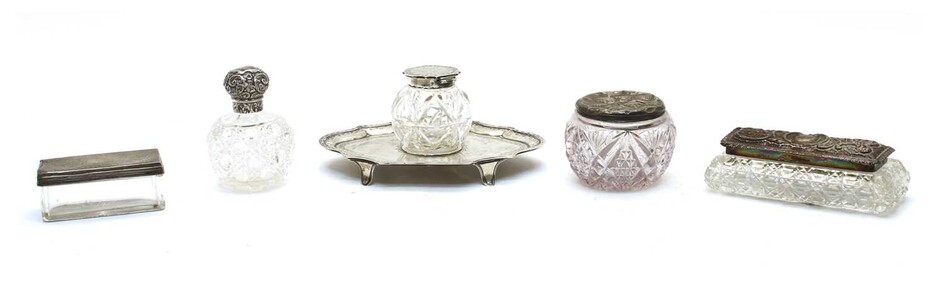 A collection of glass and silver mounted dressing table items