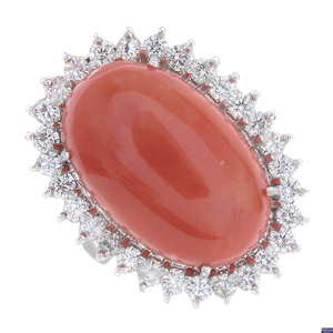A coral and diamond cluster ring.