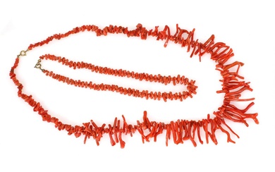A coral jewellery set comprising two coral necklaces each set with numerous...