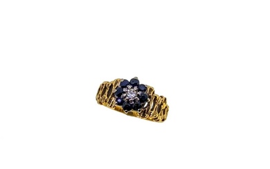 A diamond and sapphire cluster ring