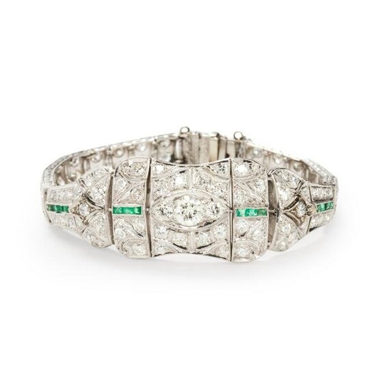 A diamond, emerald and platinum bracelet