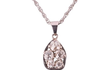 A diamond pendant necklace, featuring a cluster of old cut diamonds with a total estimated diamond w