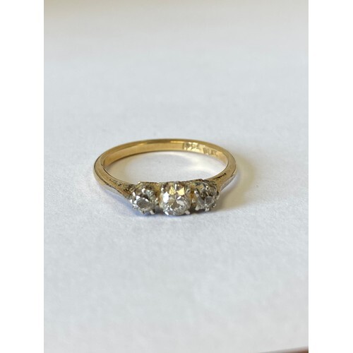 A diamond three stone ring, set in 18ct gold