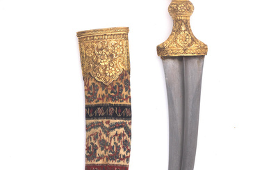 A gilt-copper mounted steel dagger (jambiyya) for the Arabian Market...