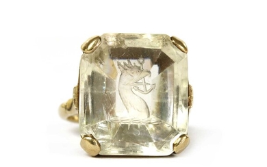 A gold intaglio engraved smoky quartz ring