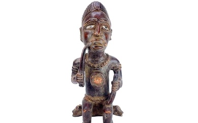 A good wood carved figure possibly Zaire Bembe. The male fig...