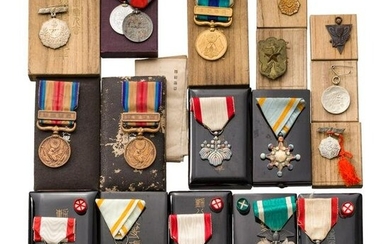 A group of 17 Japanese awards and medals with cases