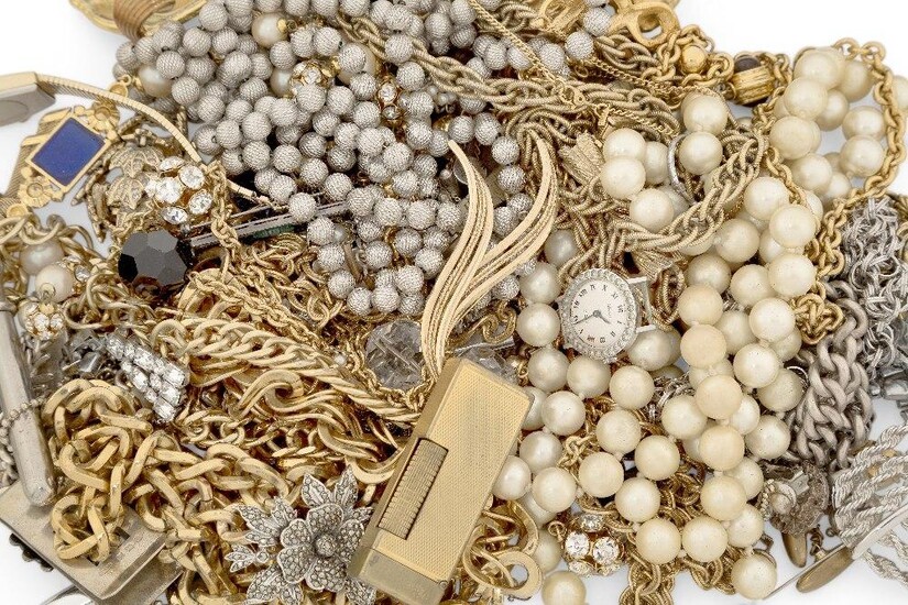 A group of costume jewellery including: a pair of cut steel and cultured pearl fan-shaped ear clips; a cased Swarovski crystal brooch and ring; a silver chain link bracelet; a gilt metal and paste leaf-design brooch with pendant fitting; a German...