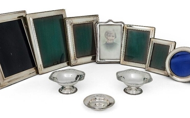 A group of eight silver mounted photo frames, various shapes and sizes, including a 999 standard silver example, of shaped rectangular form, London, 2000, Paul Vernon Fitchie, 16.2cm high, together with a pair of pierced silver bonbon dishes...