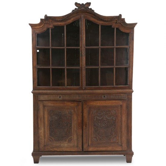 A large French oak vitrine cupboard. Late 18th century. 245 cm. W. 163 cm. W. 48 cm.