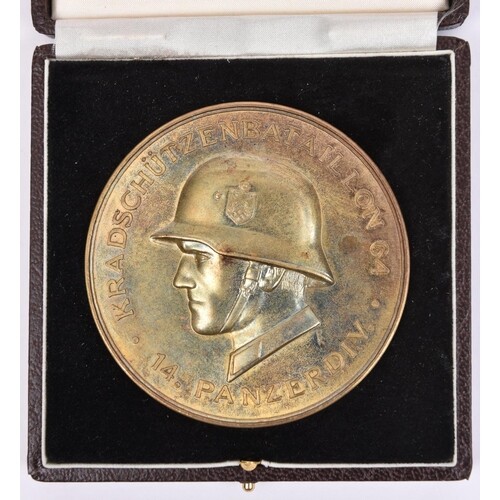 A large brass medallion, commemorating the German “Kradschut...