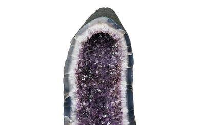 A large free standing 'cathedral' amethyst geode. Vibrant pu...