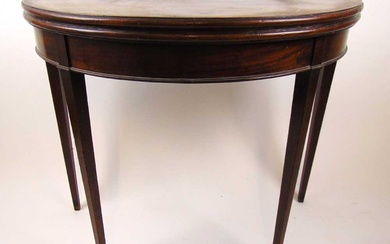 A late 18th century mahogany demi lune tea table, the...