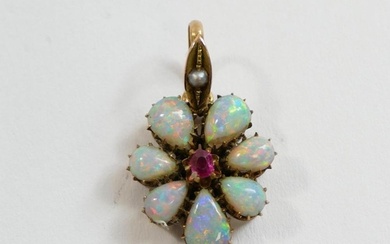 A late Victorian opal and garnet flower head pendant, the ce...