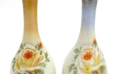 A matched pair of English bottle vases with floral rose