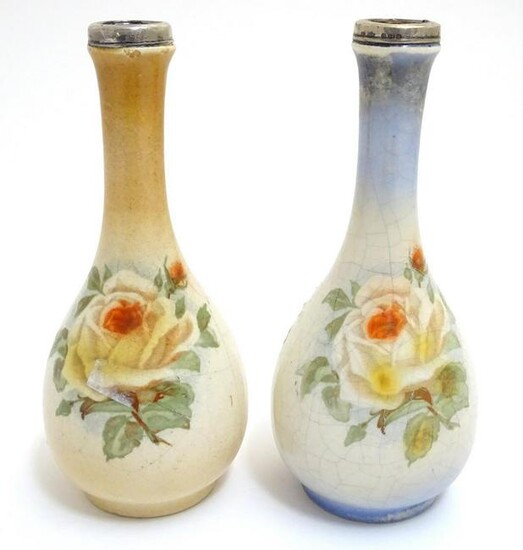 A matched pair of English bottle vases with floral rose